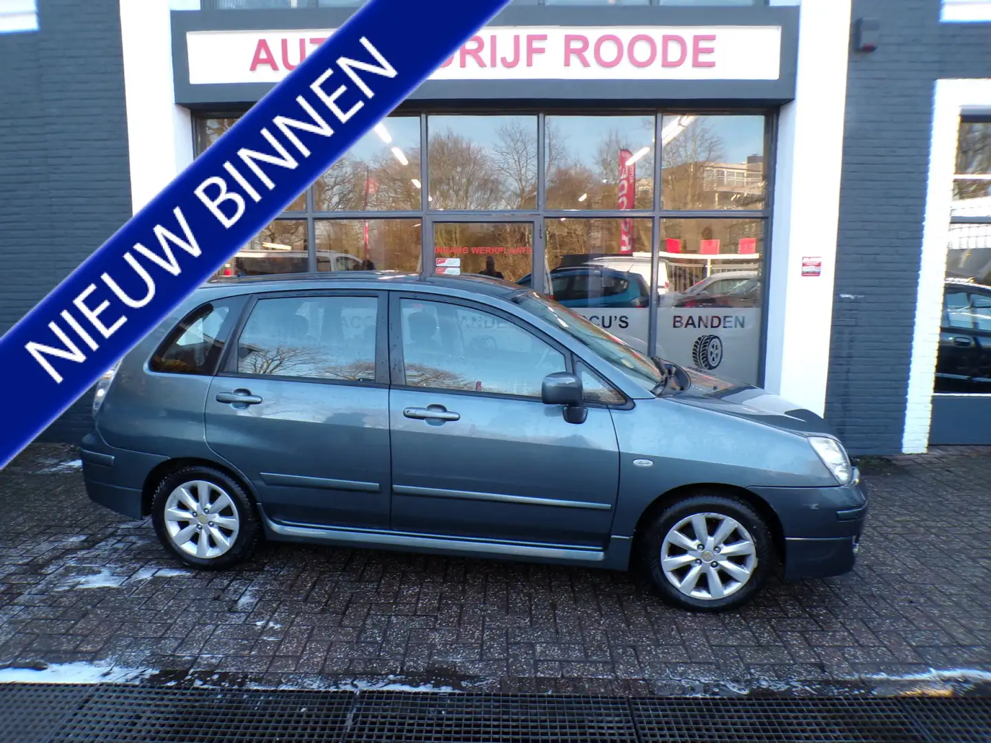 Suzuki Liana 1.6 Exclusive AUTOMAAT,CLIMA,TREKHAAK !! Grau - 1