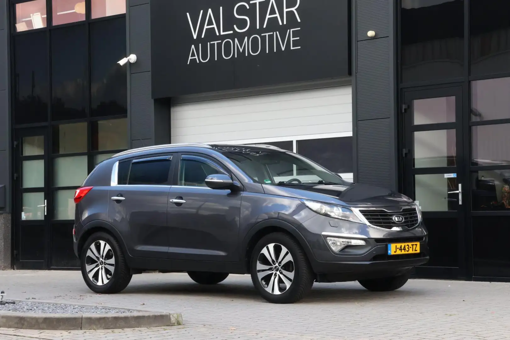 Kia Sportage 2.0 X-clusive |Trekhaak | XENON | Volle uitvoering Grijs - 1