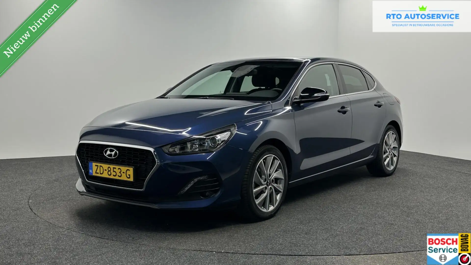 Hyundai i30 1.0 T-GDI Fastback Premium CAMERA TREKHAAK NAVI CR Blauw - 1