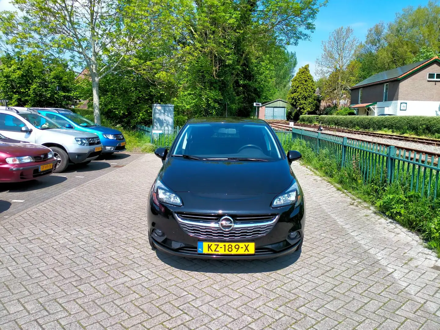 Opel Corsa 1.4 Edition + luxe uitv. clima 5 deurs lage km. RI Black - 2