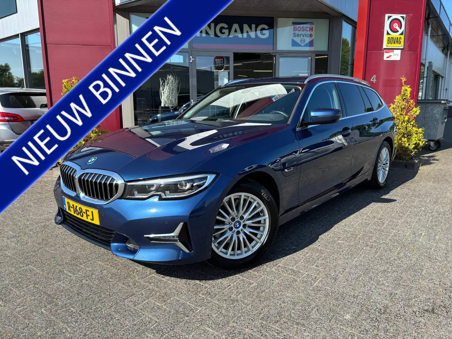 BMW 320 3-serie Touring 320e Business Edition Plus | Sport Blue - 1
