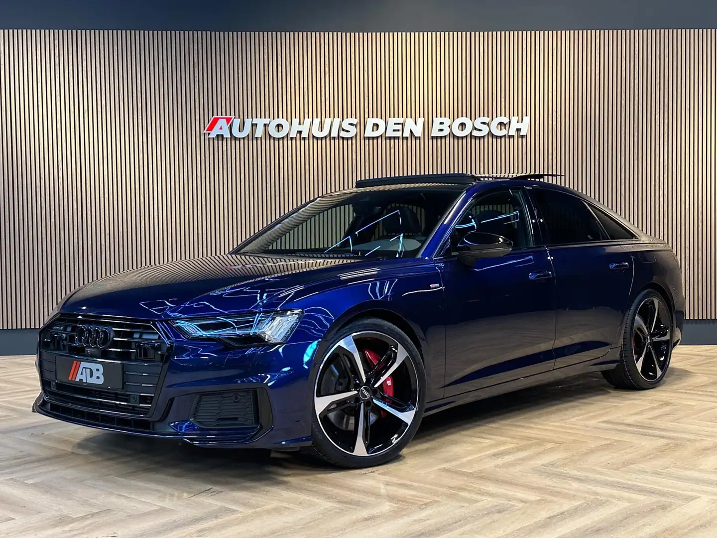 Audi A6 Limousine 55 TFSI e Quattro Competition 367PK S Li Blauw - 1