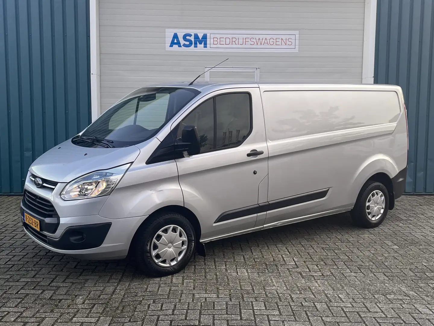 Ford Transit Custom 290 2.2 101Pk TDCI L2H1 Trend / Cruise / Airco / N Grijs - 1