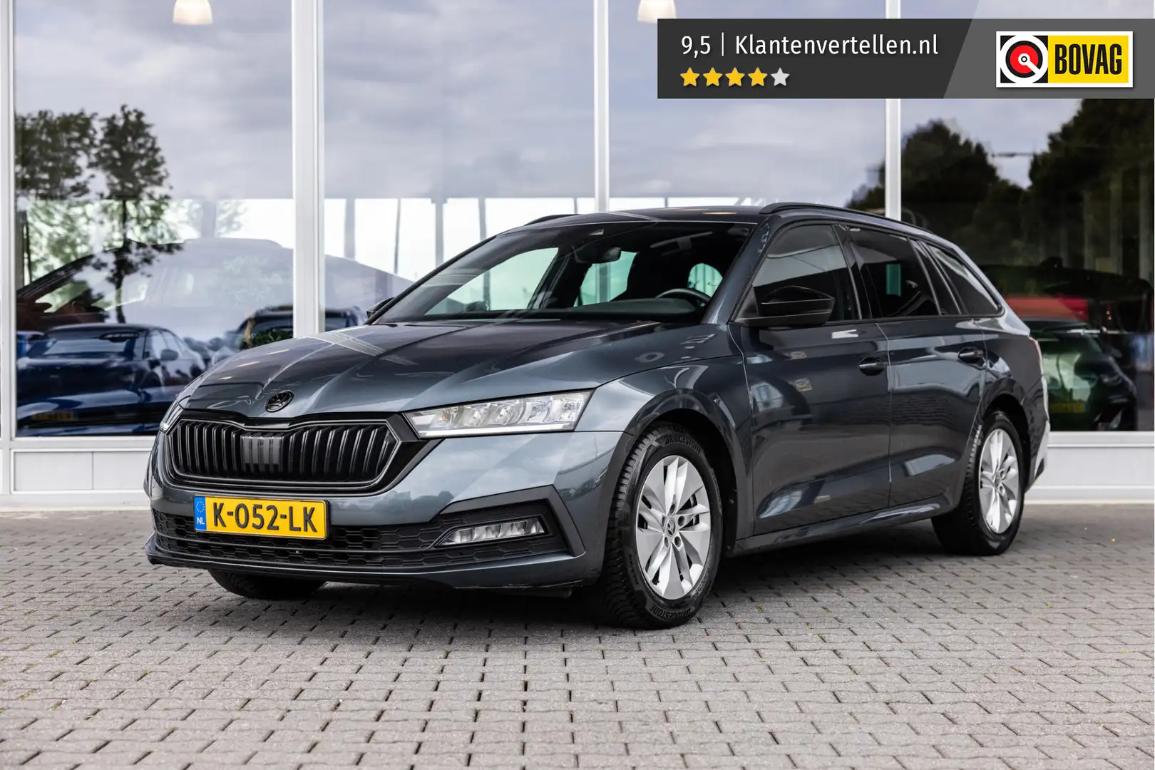 Skoda Octavia Combi 1.0 TSI Sport Business | Trekhaak | LED | NL Grijs - 1