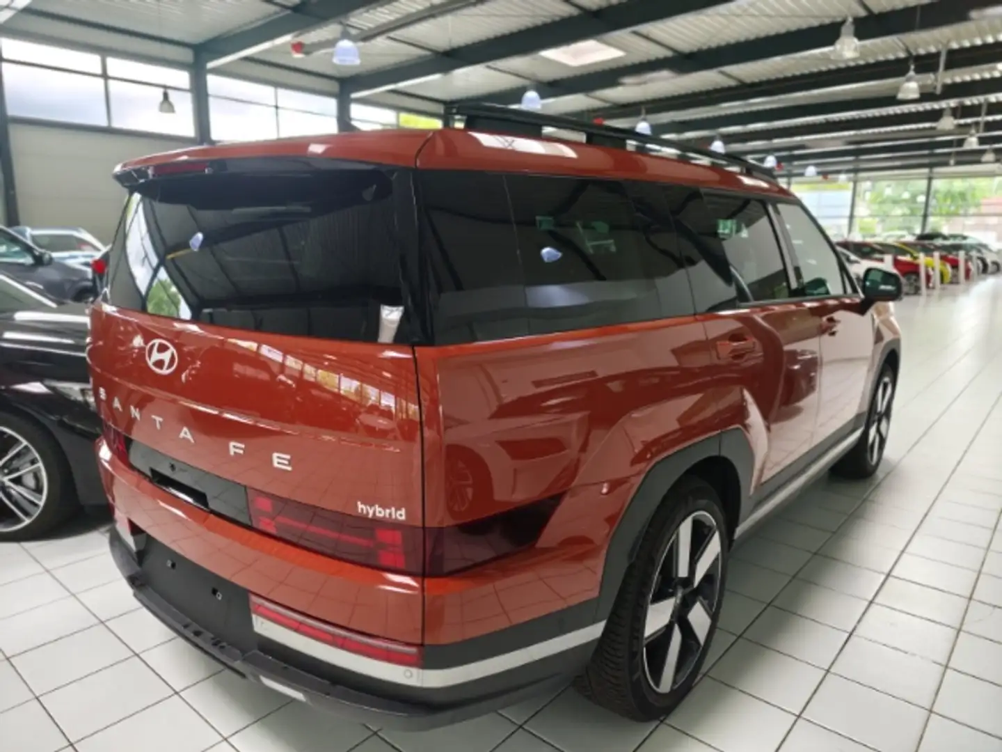 Hyundai SANTA FE Hyundai HEV 7-Sitzer (MY25) 1.6 T-GDI (215 PS) 6-A Orange - 2