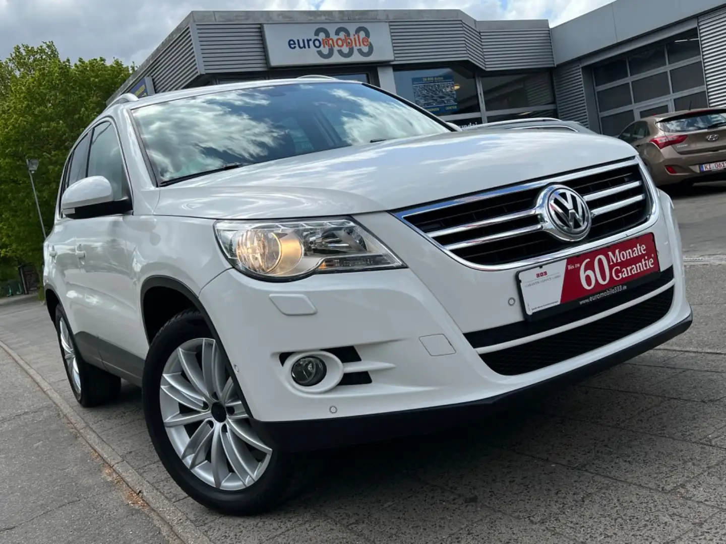 Volkswagen Tiguan 1.4TSI Team *Pano*Navi*Kamera* Weiß - 1