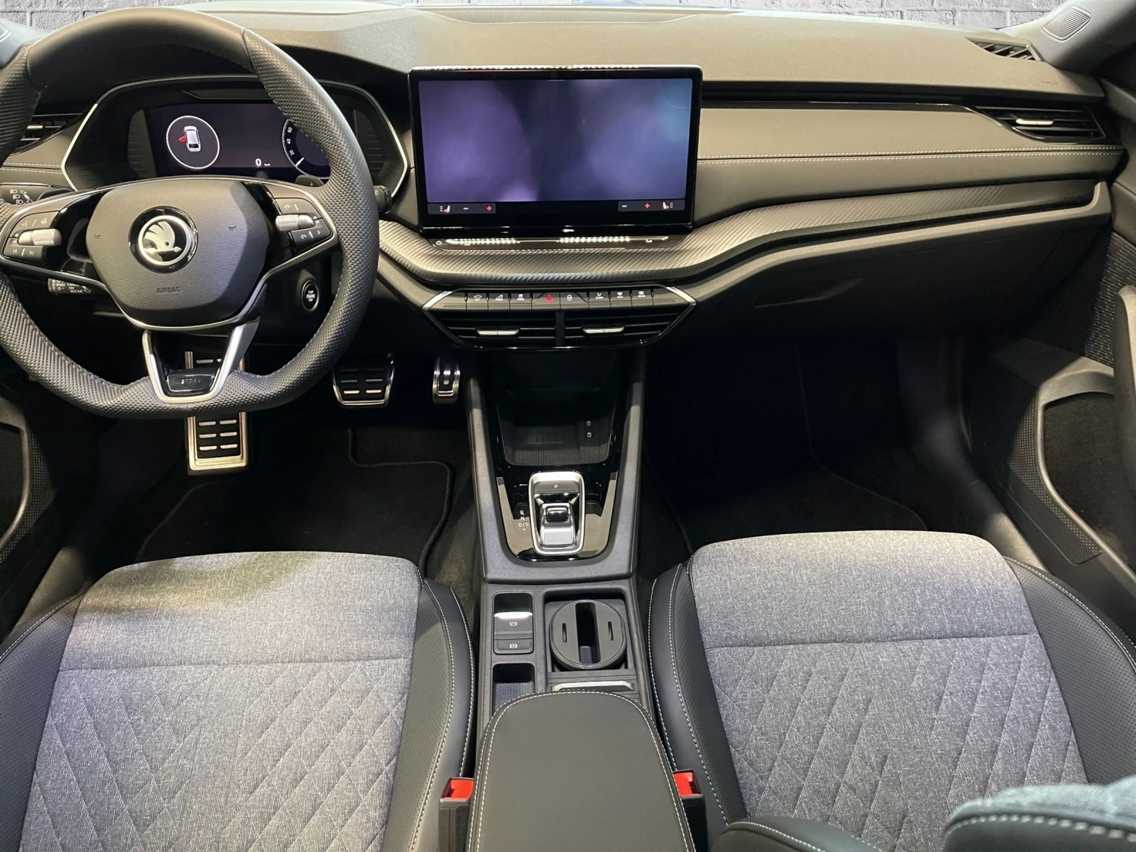 Skoda Octavia Combi 1.5 TSI mHEV DSG - Sportline — photo 11