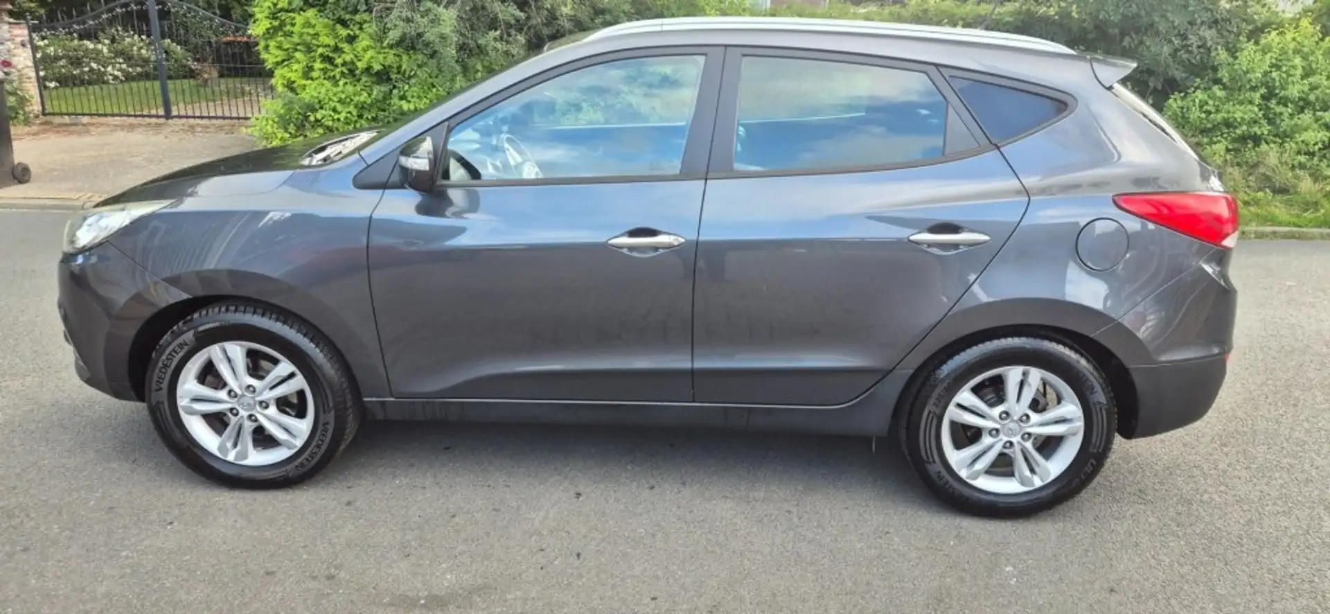 Hyundai iX35 2.0 Style*Cruise control*trekhaak*navigatie*ECC*NA Grijs - 1