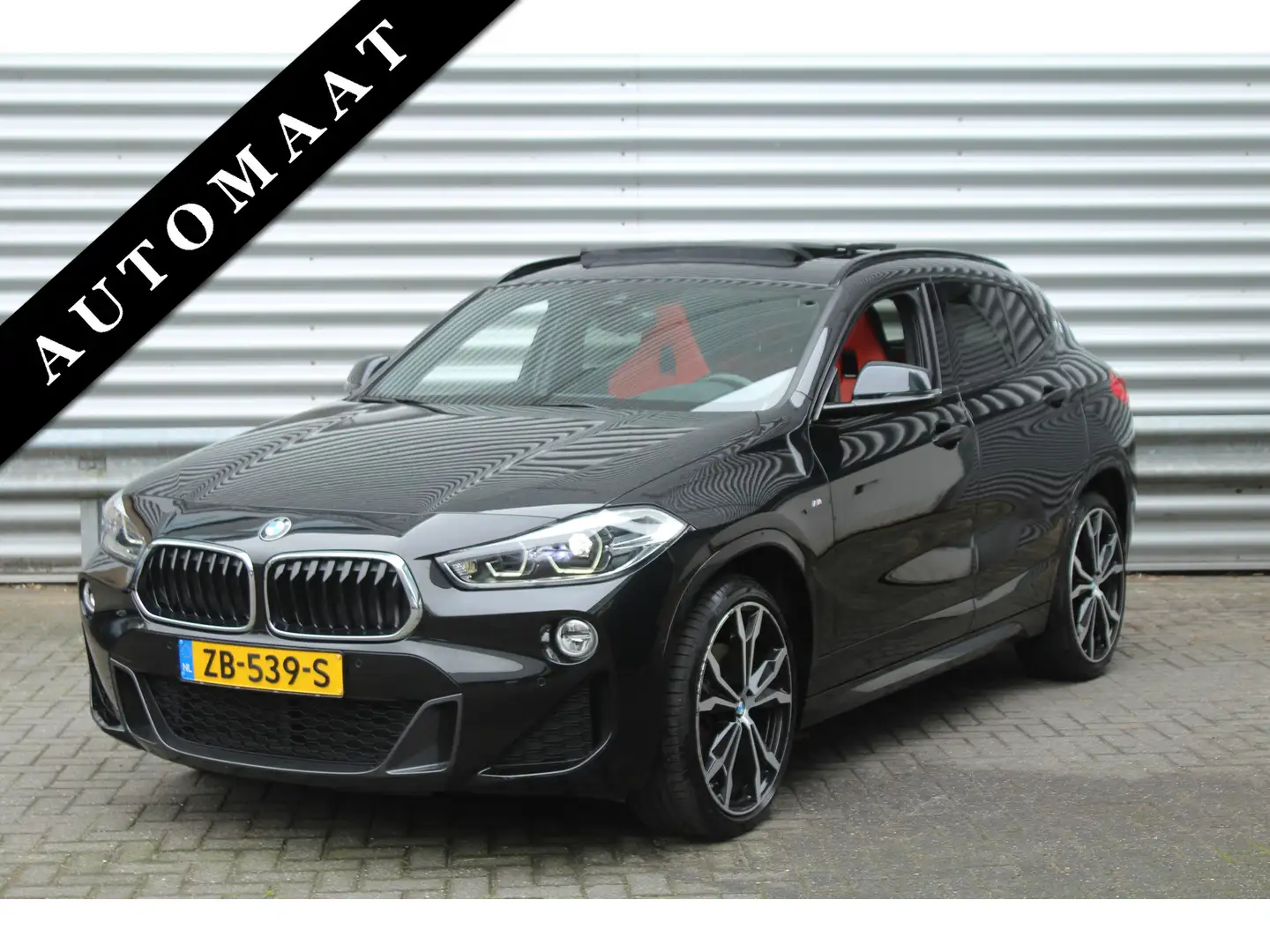 BMW X2 sDrive20i 192pk High Executive AUTOMAAT NL-Auto NA Zwart - 1