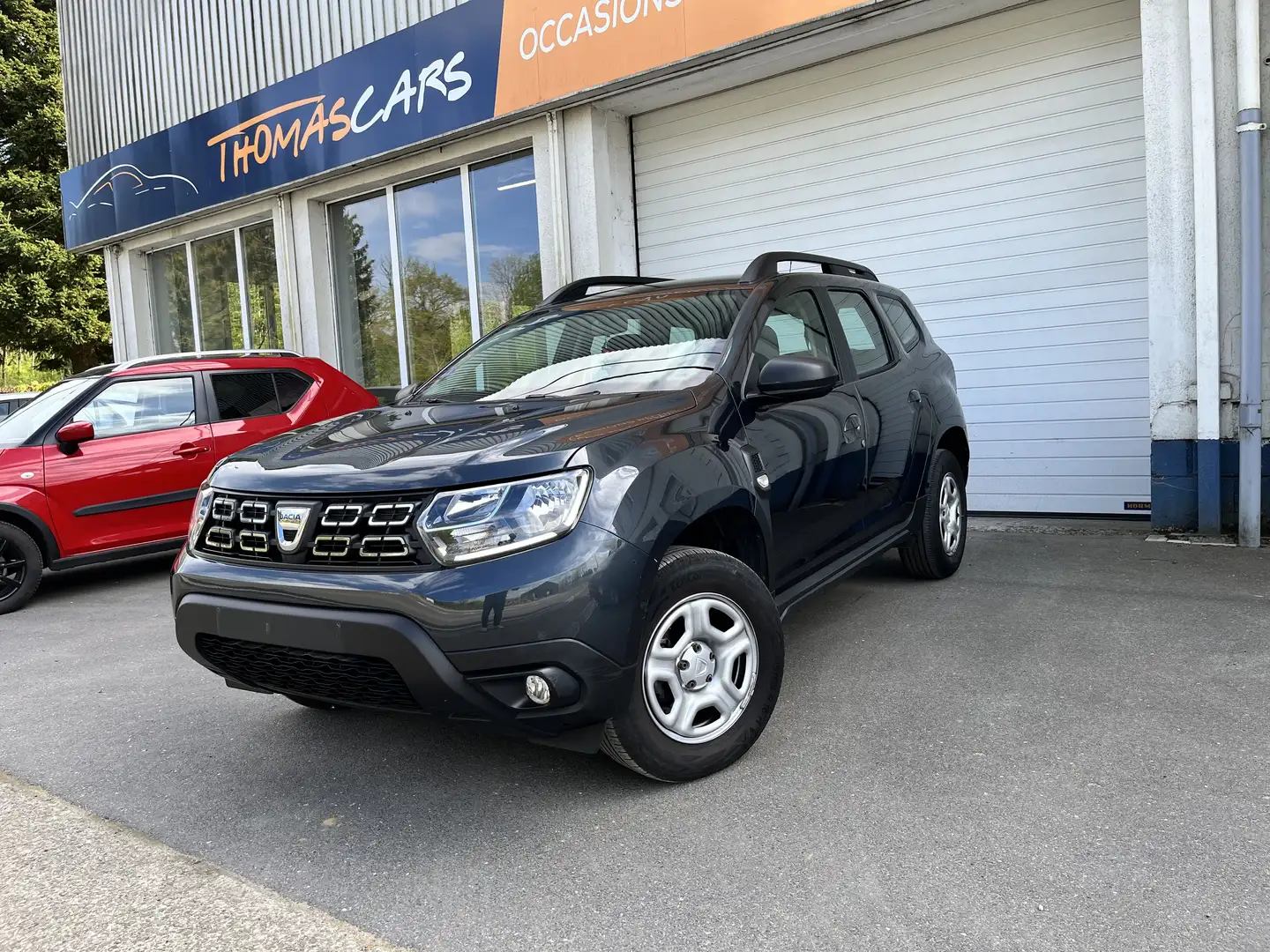 Dacia Duster 1.0 TCe Comfort + NAVY + CAMERA +ATT. REMORQUE + Grijs - 1