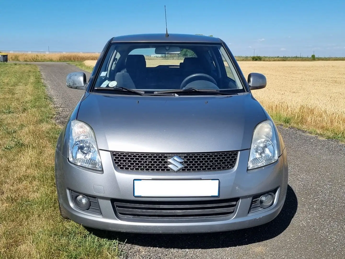 Suzuki Swift 1.3 VVT GLX 3P Gris - 2