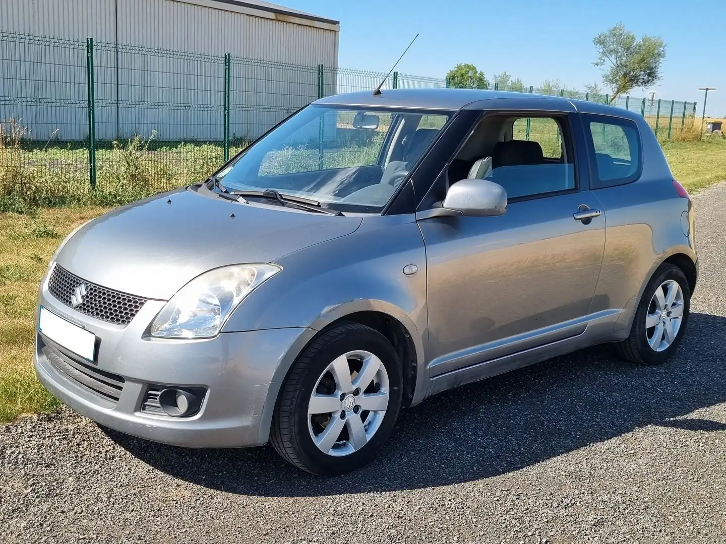 Suzuki Swift 1.3 VVT GLX 3P Gris - 1