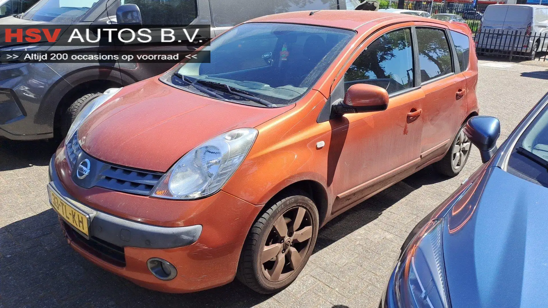 Nissan Note 1.6 Tekna automaat LM airco Oranje - 1