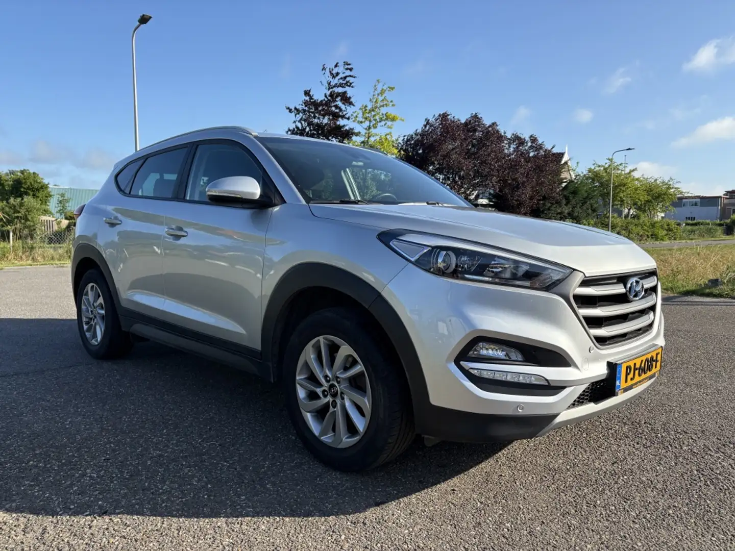 Hyundai TUCSON 1.6 GDi Anniversary Edition | Zeer compleet | Net Grijs - 1