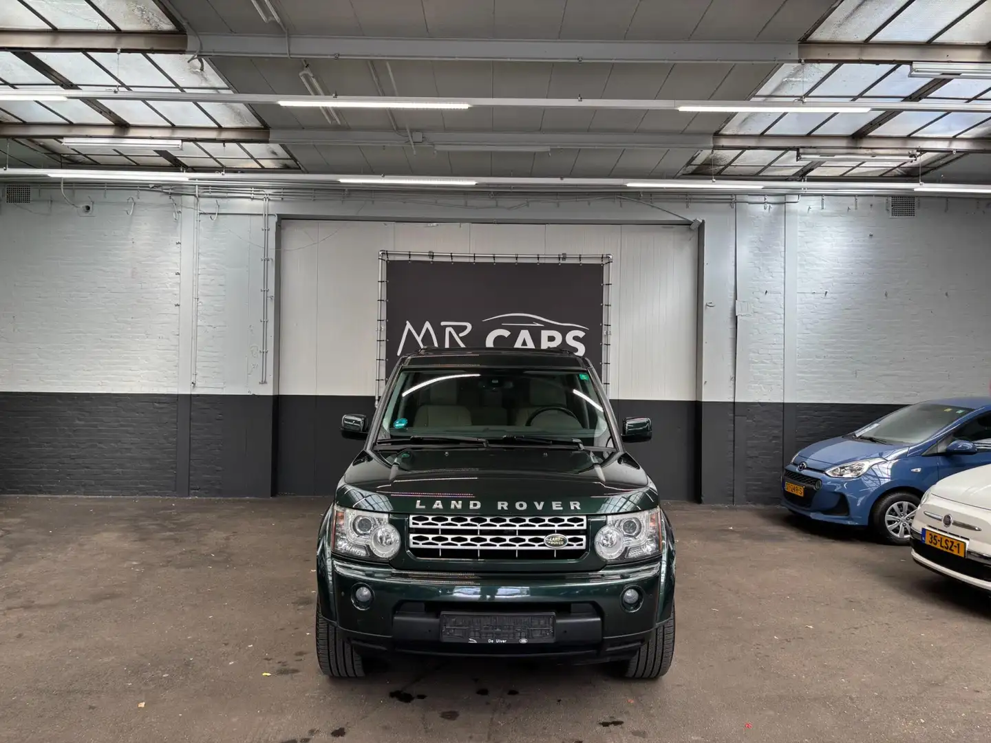 Land Rover Discovery 3.0 SDV6 HSE 7.p Groen - 1