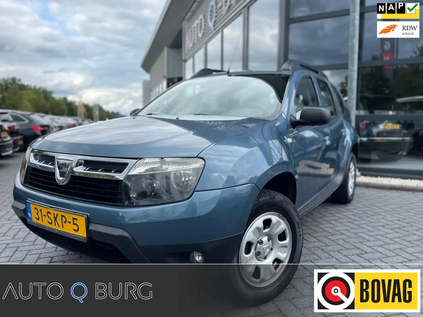 Dacia Duster 1.6 Lauréate | Airco | 4X4 | 1e Eigenaar | Origine Bleu - 1