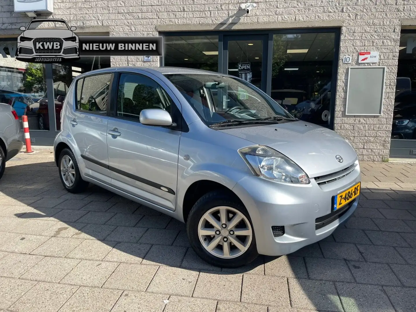 Daihatsu Sirion 2 1.3-16V Supreme Airco Nieuwe apk 5Drs Gri - 1