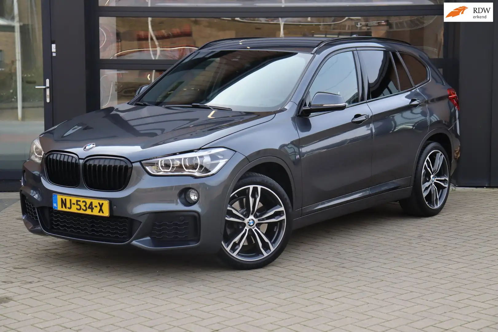 BMW X1 SDrive20i Centennial High Executive| NAP | Eerste Grau - 1