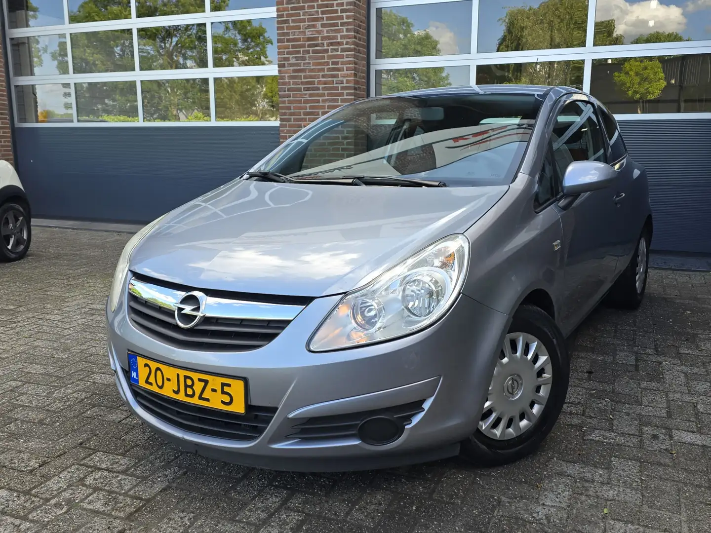 Opel Corsa 1.0-12V Essentia|Nap|Apk| Grijs - 1
