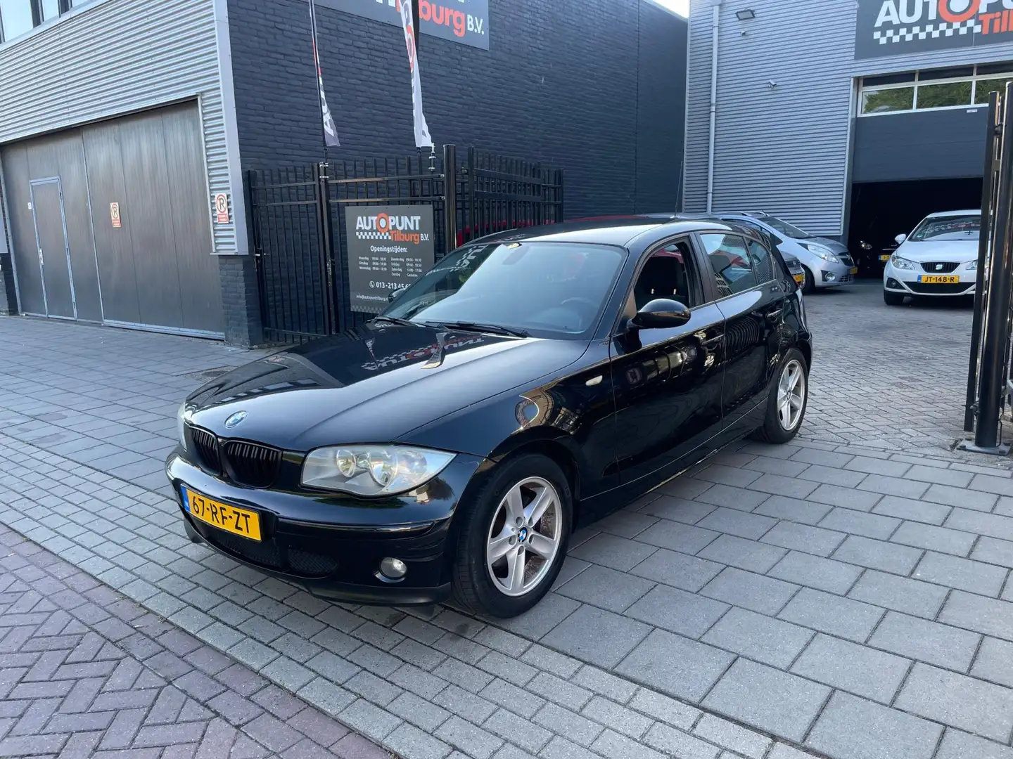 BMW 118 1-serie 118i High Executive Airco CruiseControl PD Zwart - 1