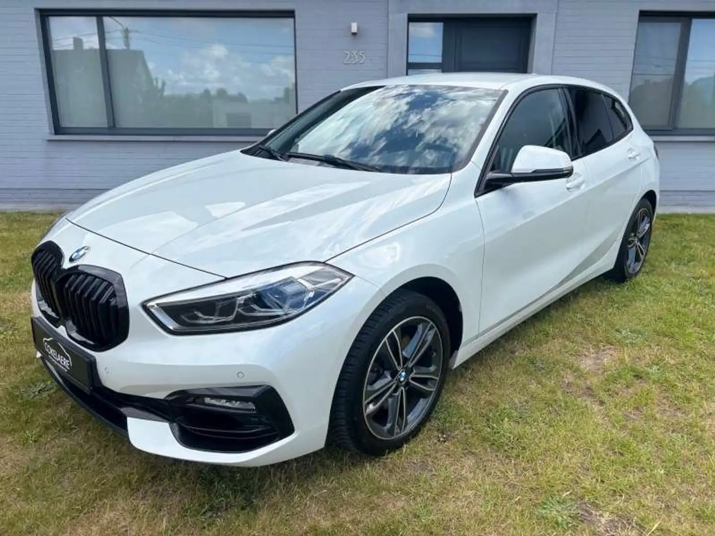 BMW 116 i SportLine Navi/LED/AutAirco/Cruise/CarPlay/DAB Wit - 1