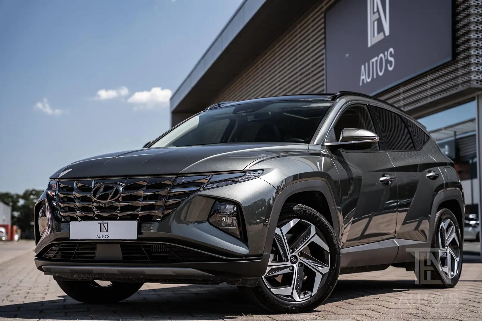 Hyundai TUCSON 1.6 T-GDI PHEV Premium Sky 4WD | Keyless | Leder | Gris - 1