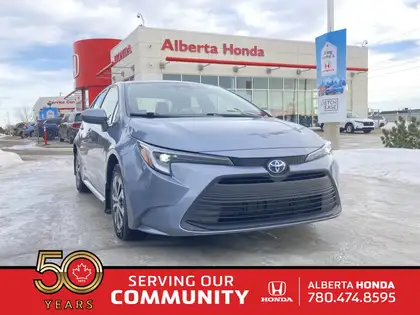 Blue 2024 Toyota Corolla Hybrid LE FWD Sedan Front-Wheel Drive Continuously Variable Transmission