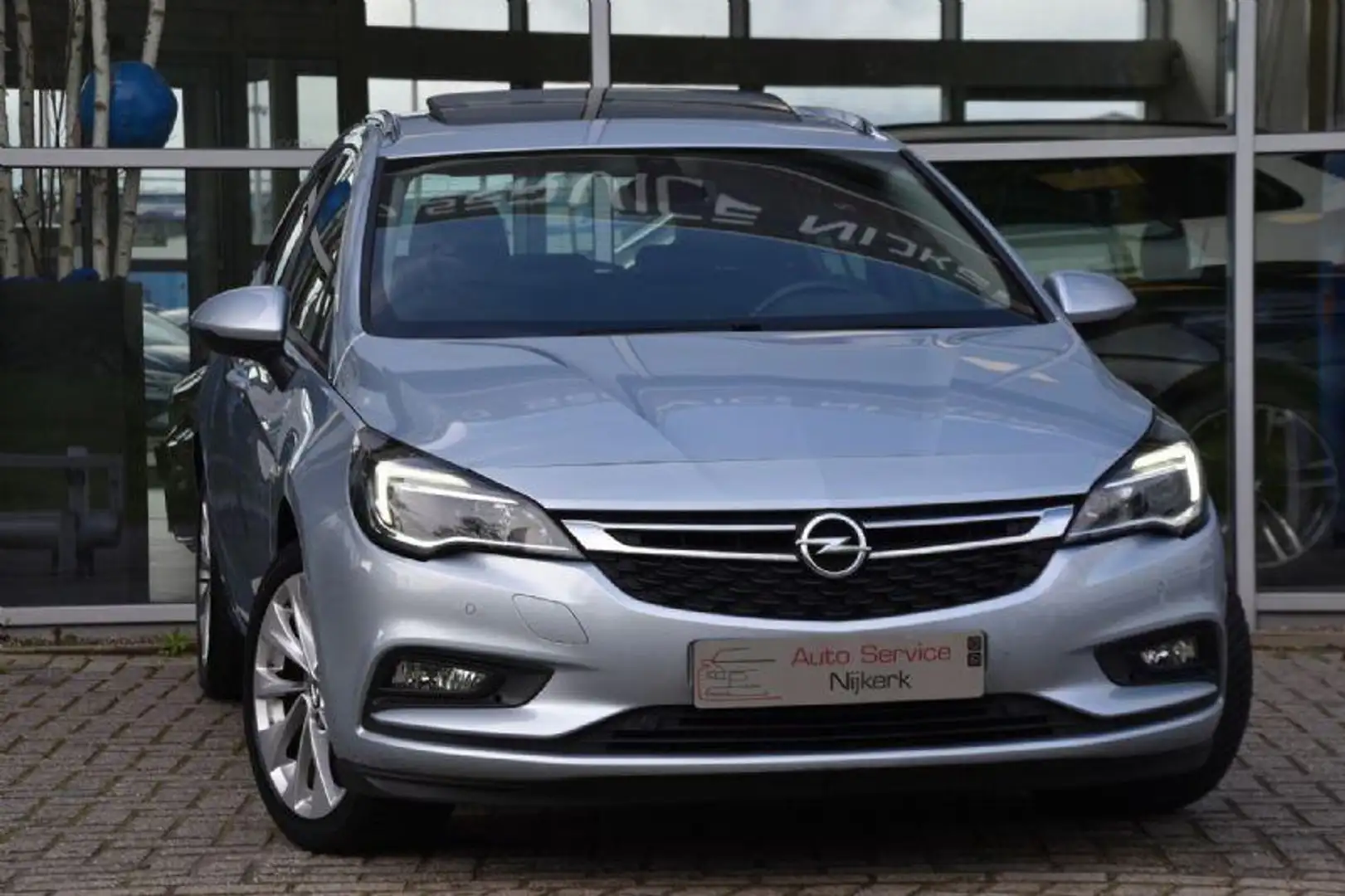 Opel Astra Sports Tourer 1.0 Edition Airco Nav. Dak Led Pdc T Grijs - 1
