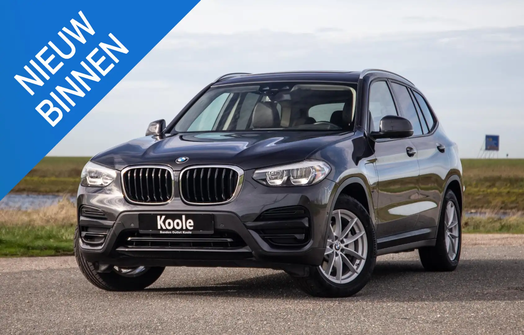 BMW X3 xDrive30e High Executive BRUIN LEER / PANORAMA DAK Grijs - 1
