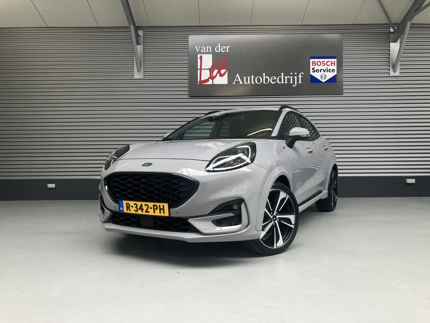 Ford Puma 1.0 HYBR ST-Line X/PDC/CAM/B&O/DRIVE ASS/TREKH/EL Grijs - 1