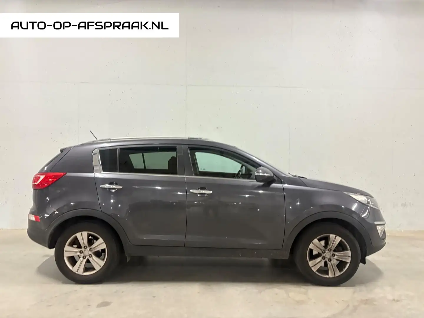 Kia Sportage 1.6 GDI Plus Pack Airco Clima Cruise Control Trekh Gris - 1