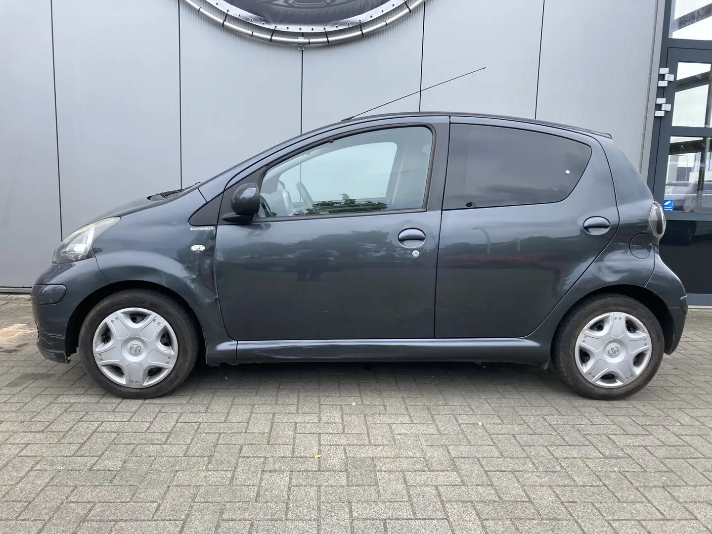 Toyota Aygo 1.0-12V Comfort Navigator Navigatie | Airco Gris - 1