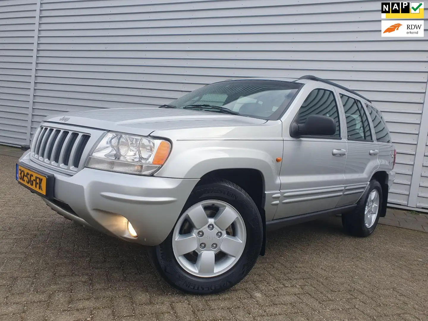 Jeep Grand Cherokee 4.7i V8 Limited Clima/Cruise/Leder Grau - 1