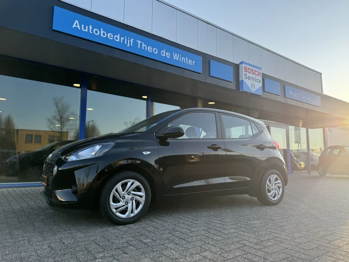 Hyundai i10 1.0 Comfort| Airco, Stoelverwarming, Cruise Zwart - 1
