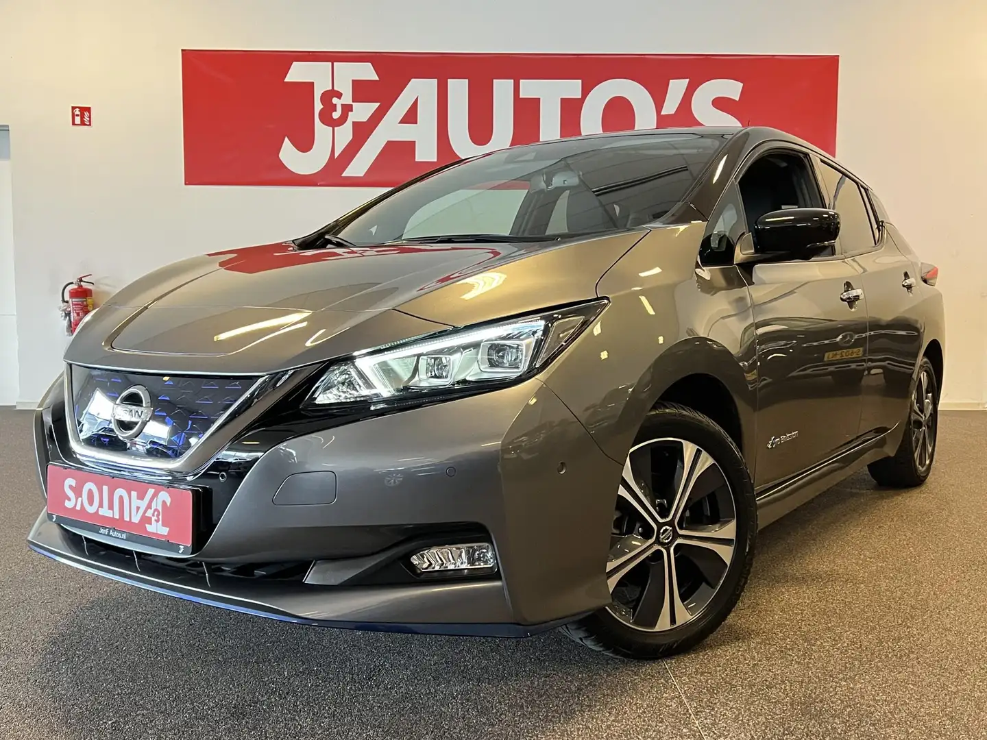 Nissan Leaf e+ TEKNA 62 kWh LEER, NAVIGATIE/CAMERA, CRUISE, 21 Grijs - 1