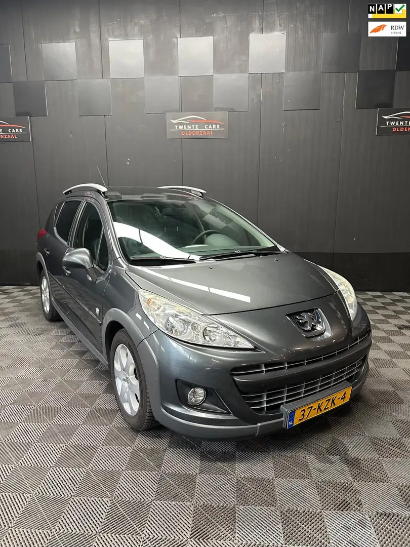Peugeot 207 SW Outdoor 1.6 VTi | Leder | Clima | Pano | Nieuwe Grau - 1