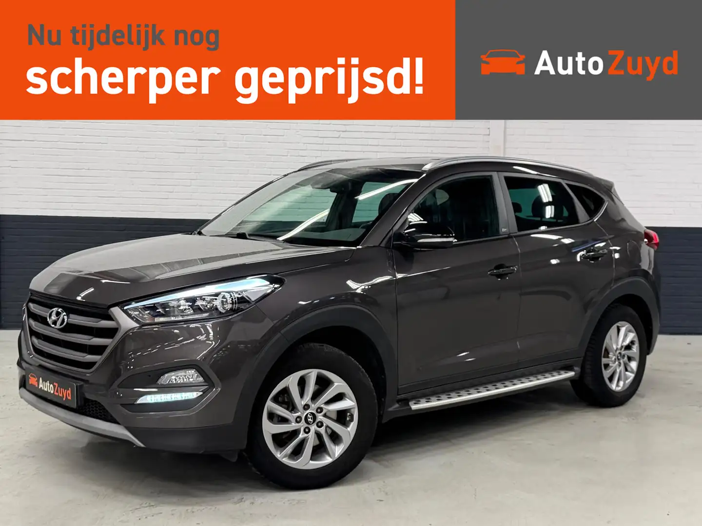 Hyundai TUCSON 1.6 GDi Comfort / Camera / Trekhaak / Navi / Stoel Grijs - 1