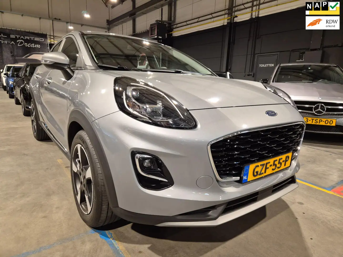 Ford Puma 1.0 EcoBoost Automaat - Clima - Cruise - PDC - Nav Grijs - 1
