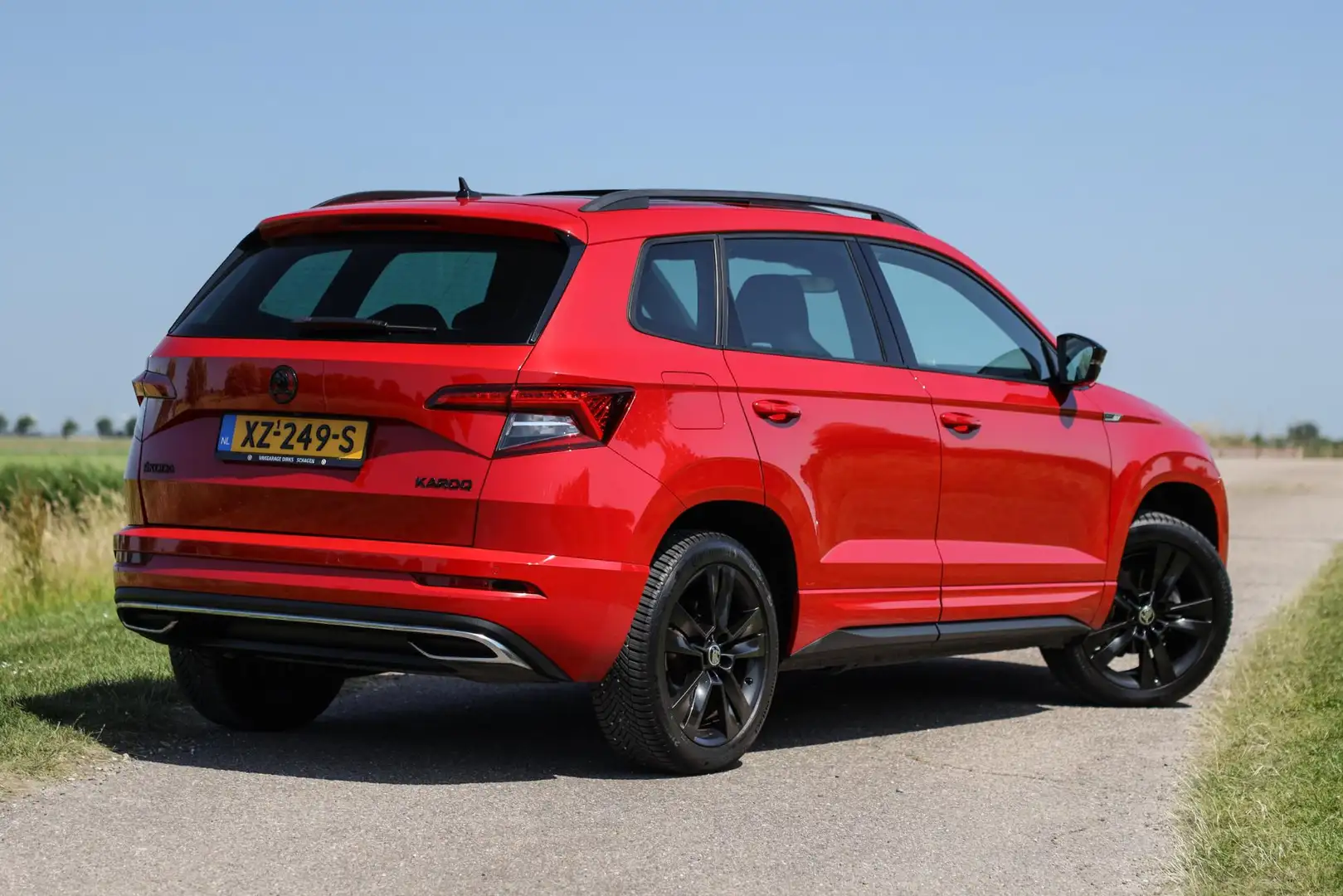 Skoda Karoq 1.5 TSI 150PK DSG Sportline ✅ Pano ✅ LED ✅ ACC Rosso - 2
