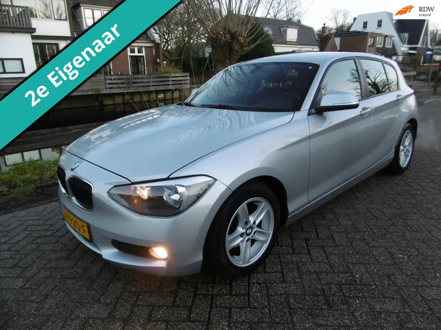 BMW 116 1-serie 116i 5-deurs 136pk Airco PDC 2e eigenaar Z Gris - 1