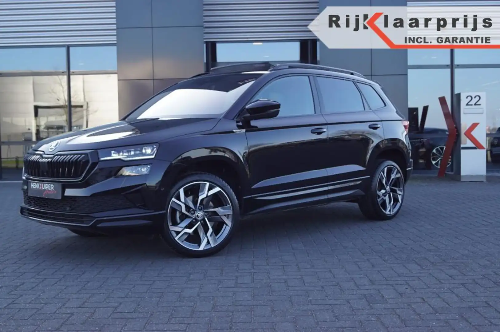 Skoda Karoq 1.5 TSI DSG Sportline/ Panodak/ Navi/19 LM /Camera Zwart - 1