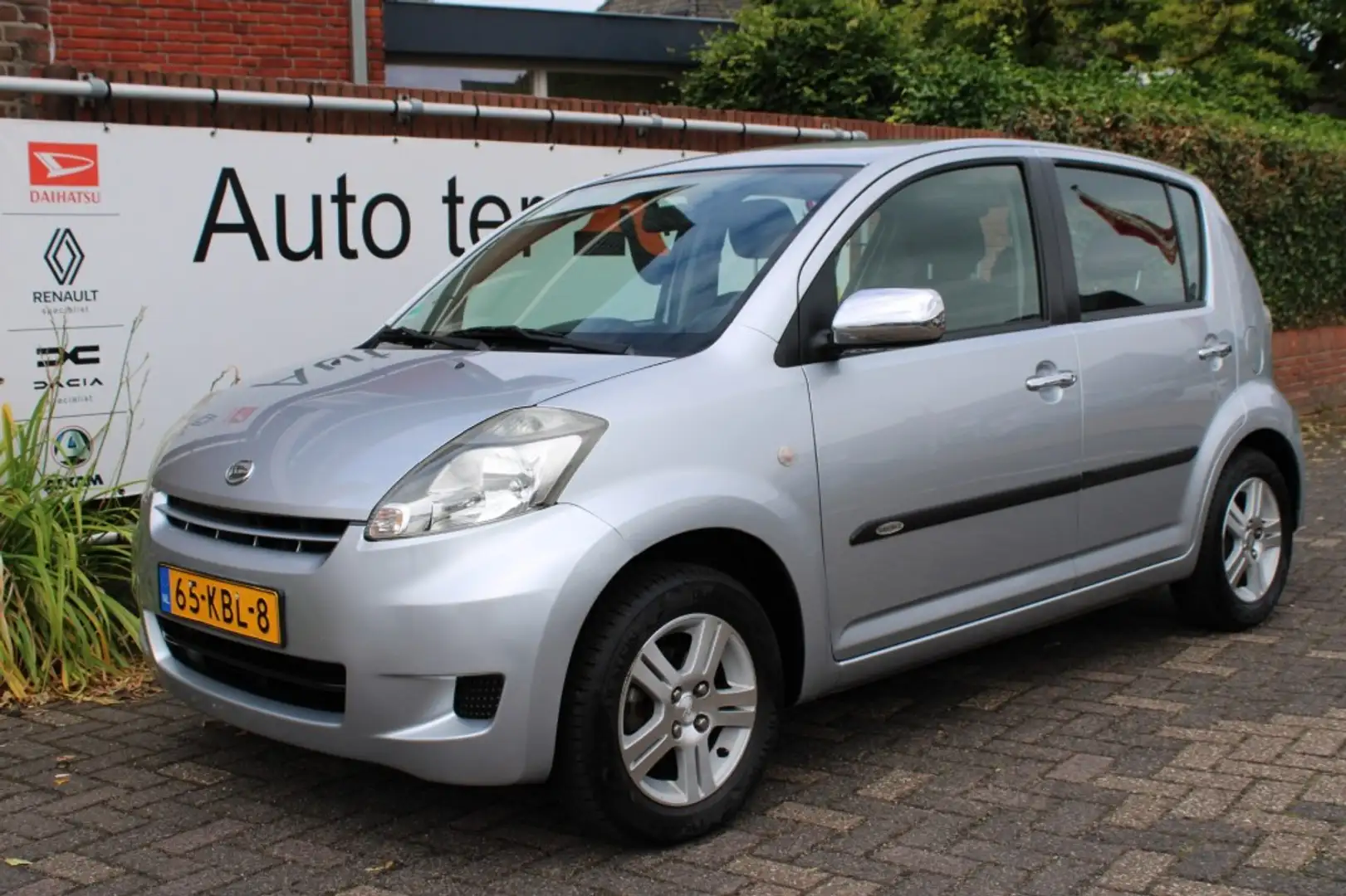 Daihatsu Sirion 1.0 12V Premium Grijs - 1
