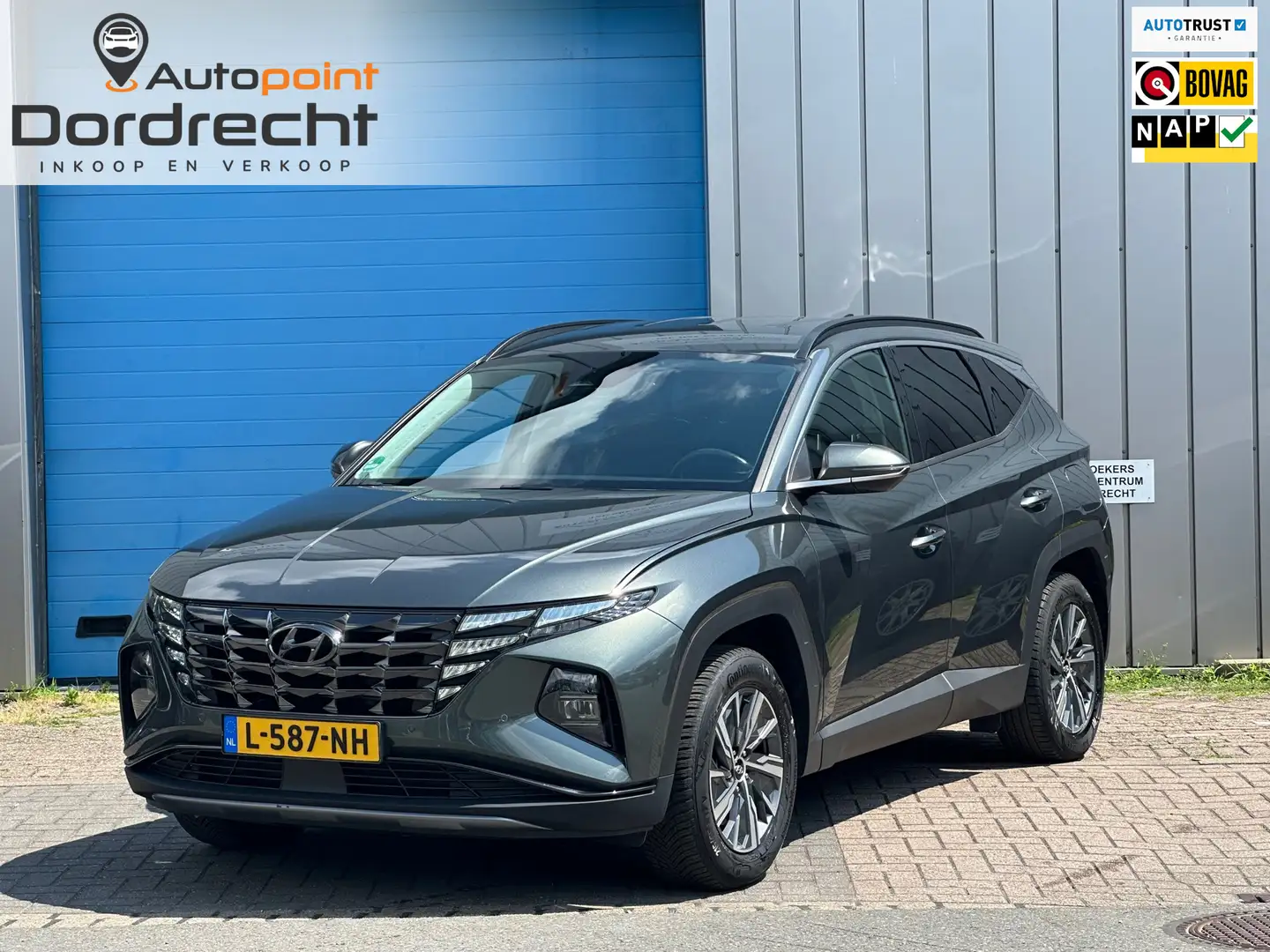 Hyundai TUCSON 1.6 T-GDI HEV Comfort DEALER OND 1 EIG Grijs - 1