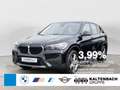 BMW X1 sDrive18i Advantage FACEL. AHK NAVI SHZ Zwart - thumbnail 1