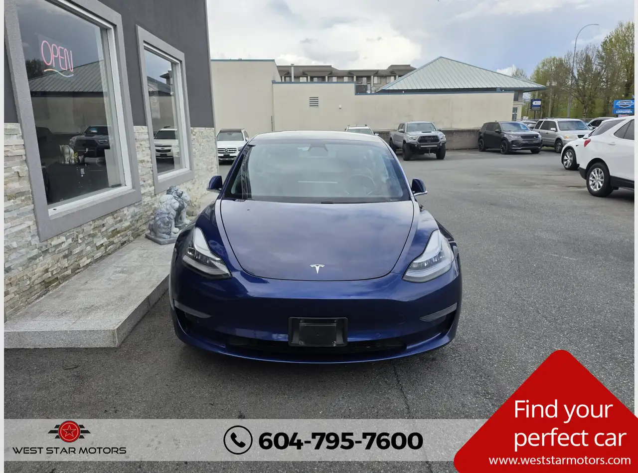 Tesla Model 3 photo Tesla Model 3