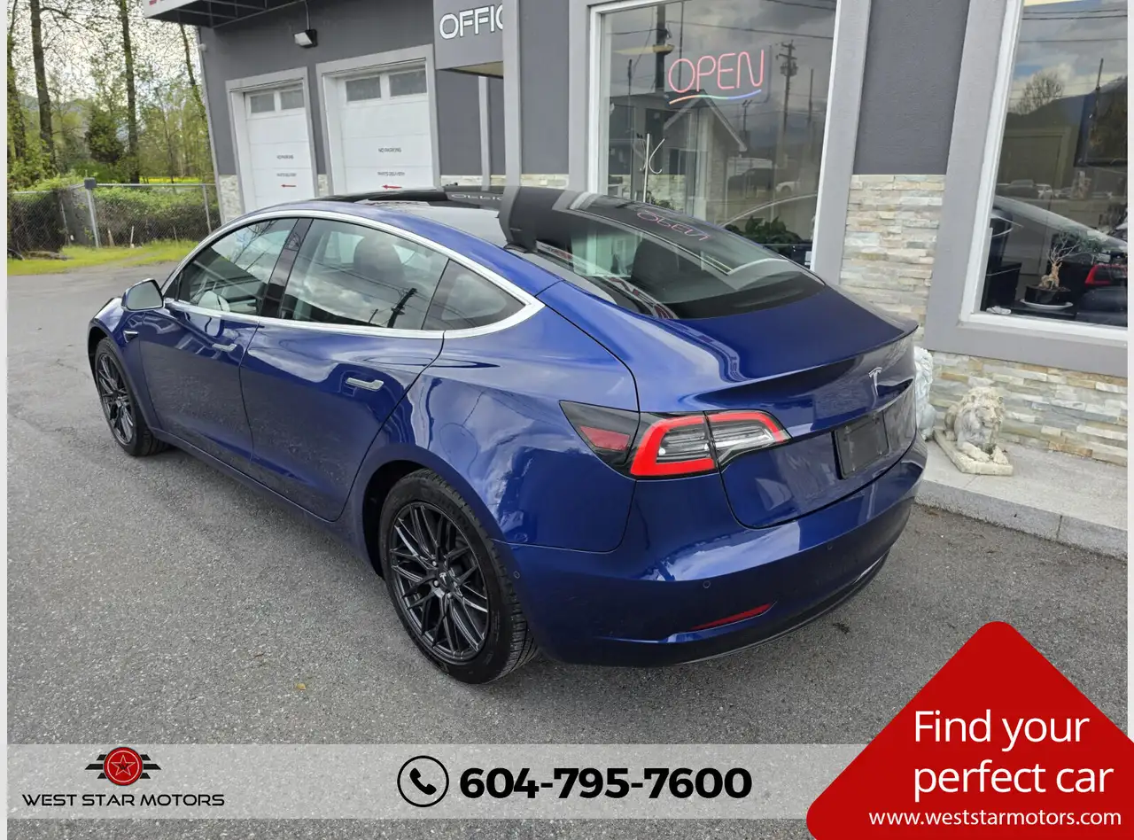 Tesla Model 3 photo Tesla Model 3
