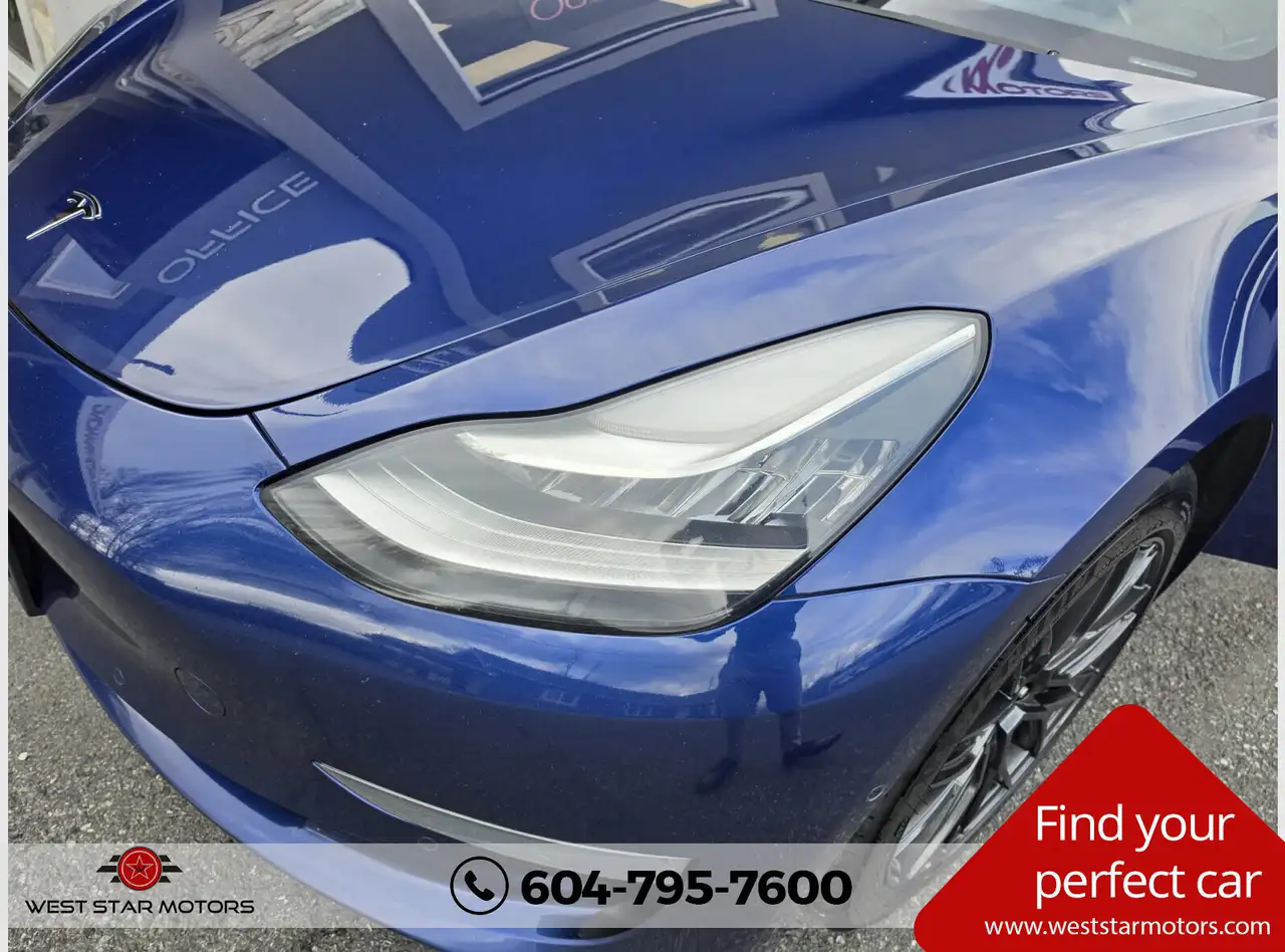 Tesla Model 3 photo Tesla Model 3