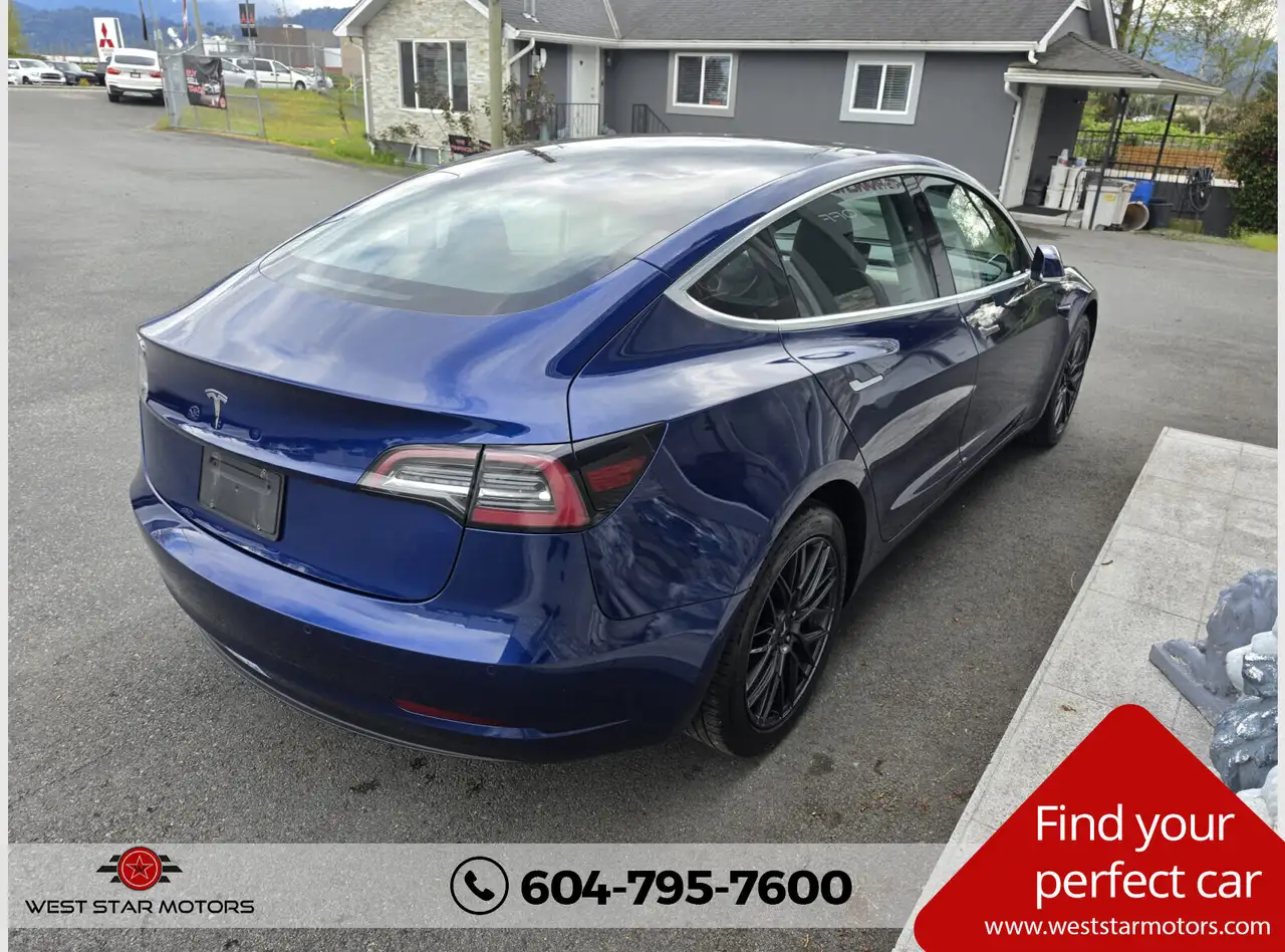 Tesla Model 3 photo Tesla Model 3