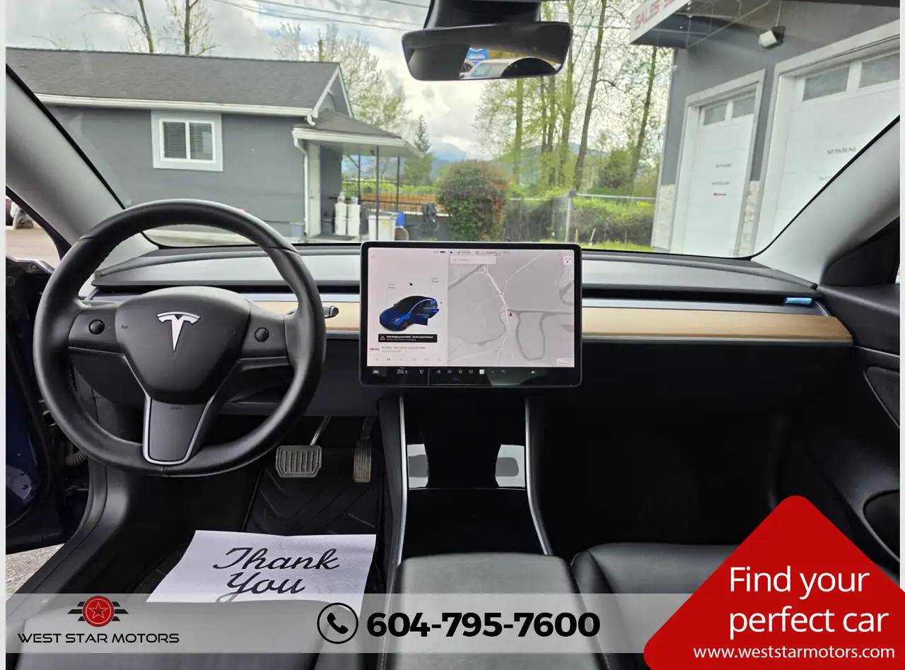 Tesla Model 3 photo Tesla Model 3