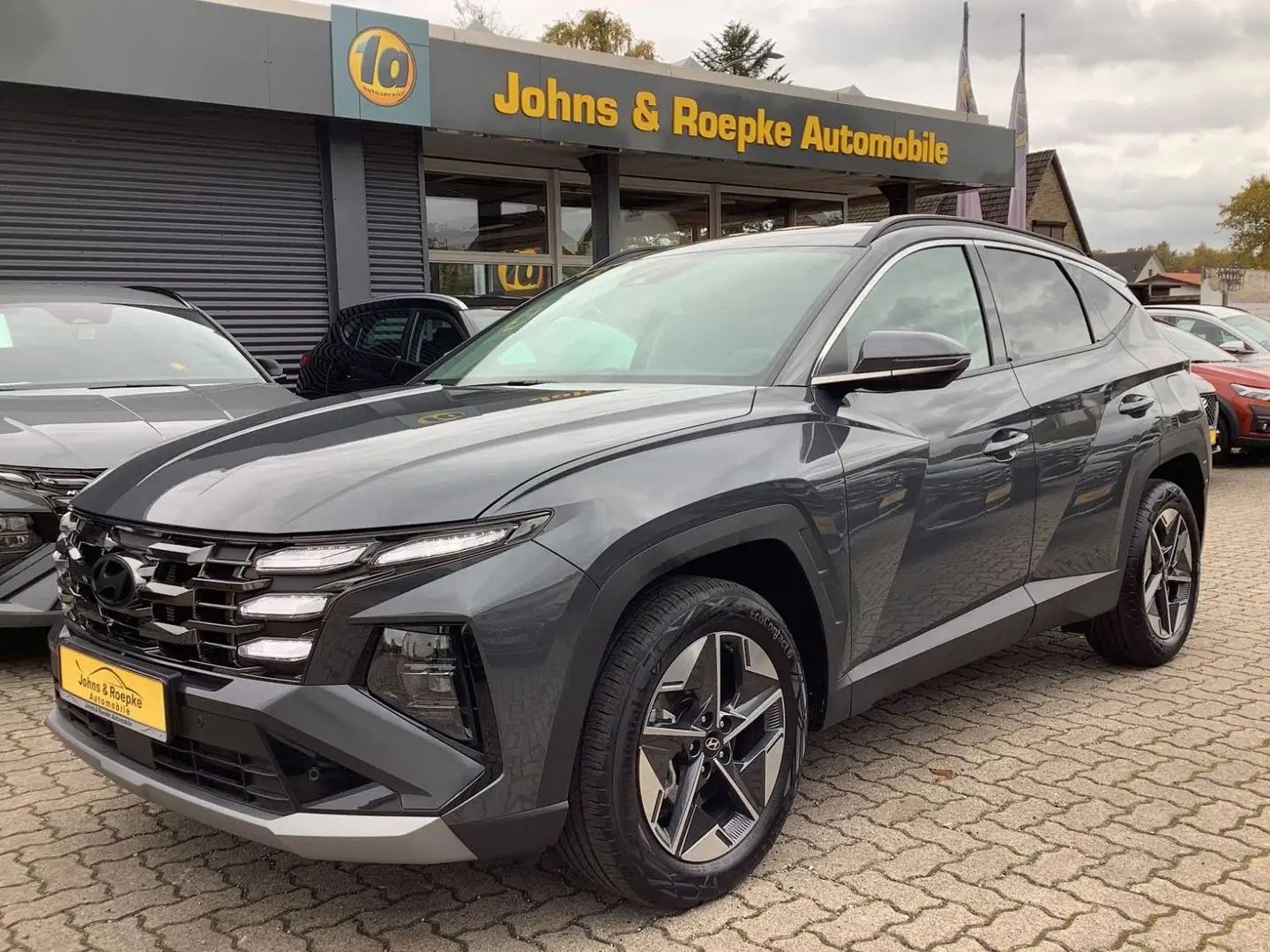 Hyundai TUCSON 1,6 Automatik / NAVI / SITZ+LENKRAD-HZG Grau - 1